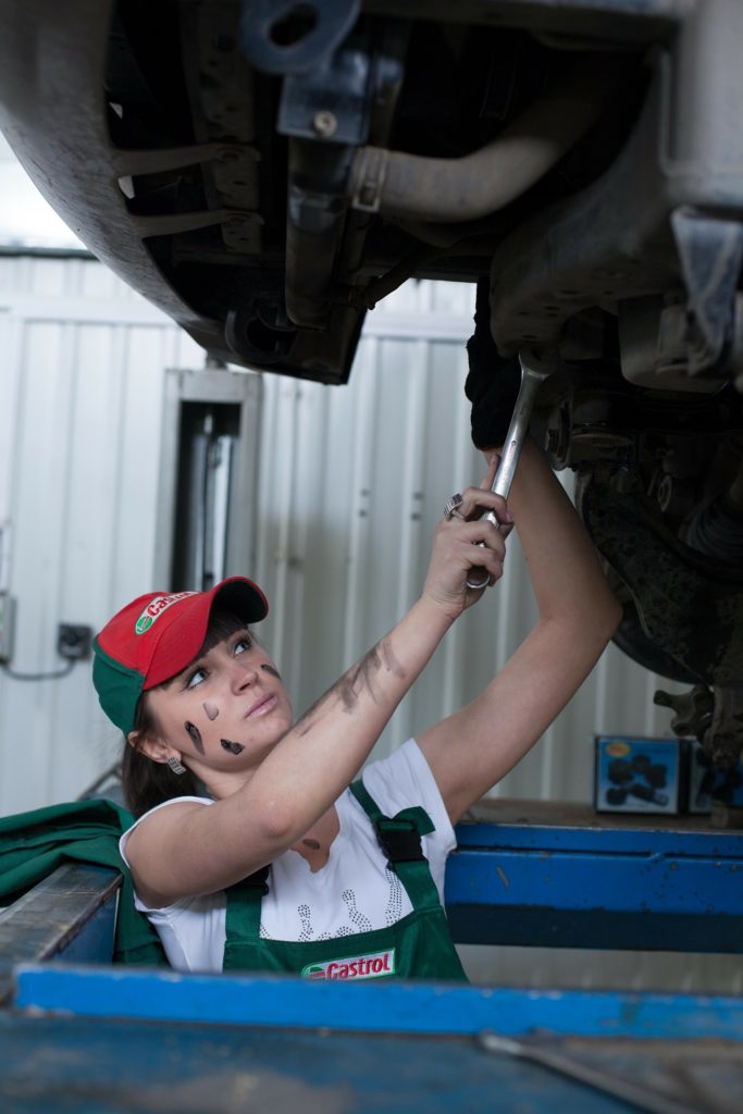 Woman repairing engine